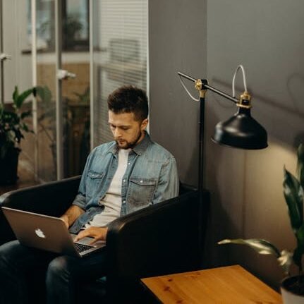 Chandragupta, Applications Lead Developer, focusing on app development and coding in a creative workspace.-home